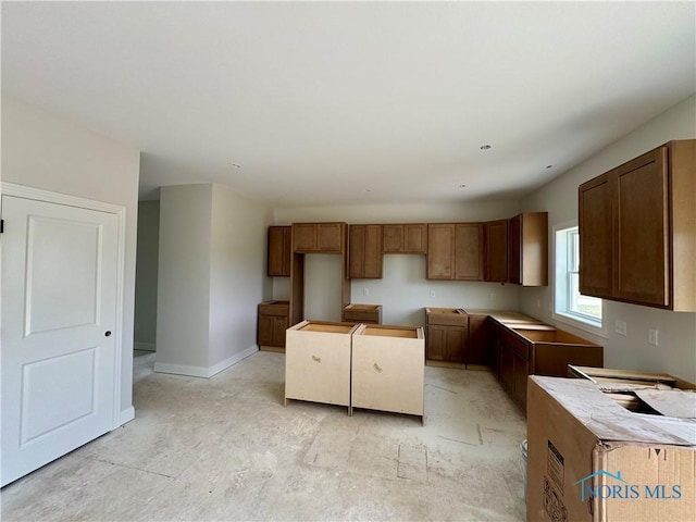 1924 Caleb Ct, Waterville, OH 43566 - kitchen with baseboards and brown cabinetry