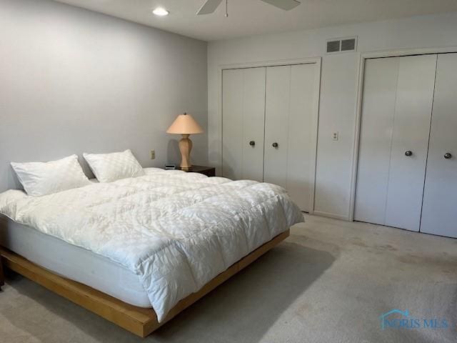 6047 Peppermill Dr, Sylvania, OH 43560 - bedroom featuring two closets, light colored carpet, recessed lighting, and ceiling fan