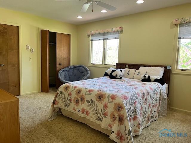 6047 Peppermill Dr, Sylvania, OH 43560 - bedroom with carpet floors, multiple windows, recessed lighting, baseboards, and ceiling fan