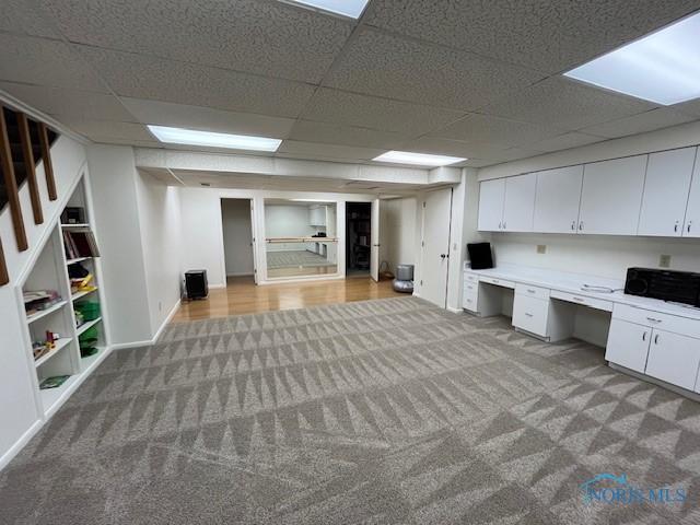 6047 Peppermill Dr, Sylvania, OH 43560 - unfurnished office featuring carpet, a drop ceiling, built in desk, and baseboards