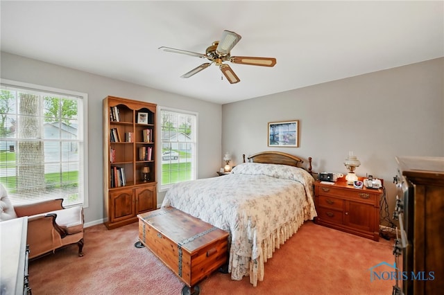 805 N Hill Trl, Findlay, OH 45840 - bedroom with light carpet, ceiling fan, and baseboards