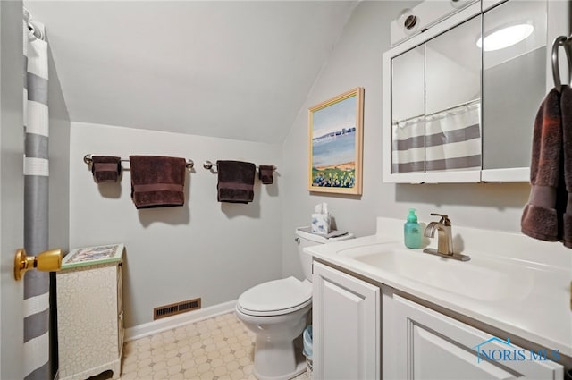 805 N Hill Trl, Findlay, OH 45840 - bathroom with tile patterned floors, lofted ceiling, vanity, and toilet