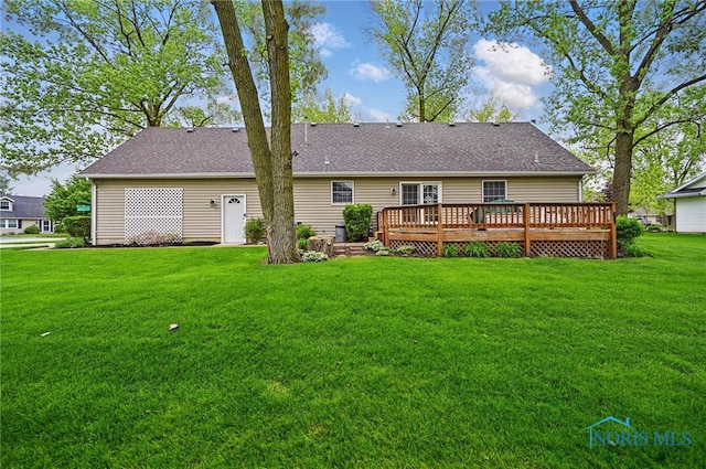 805 N Hill Trl, Findlay, OH 45840 - back of property featuring a wooden deck, a yard, and roof with shingles