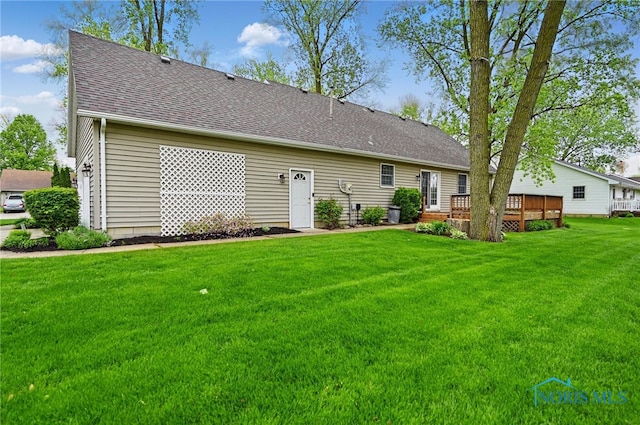 805 N Hill Trl, Findlay, OH 45840 - back of property with a deck, a lawn, and a shingled roof