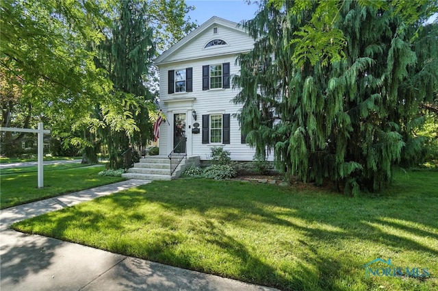232 E Wayne St, Maumee, OH 43537 - greek revival house featuring a front yard