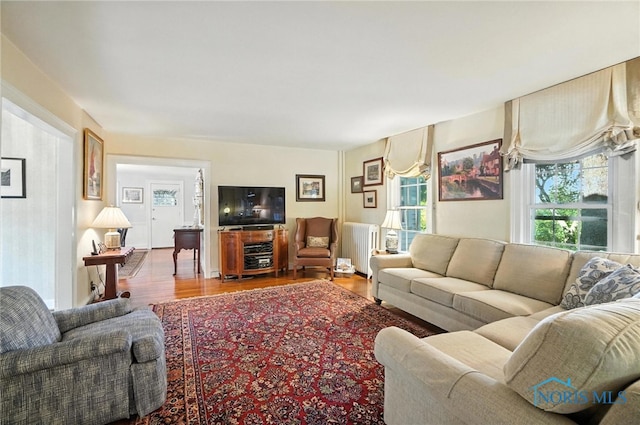 232 E Wayne St, Maumee, OH 43537 - living area with radiator heating unit and wood finished floors