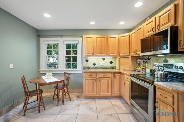 232 E Wayne St, Maumee, OH 43537 - kitchen with electric stove, backsplash, recessed lighting, light tile patterned flooring, and light brown cabinets