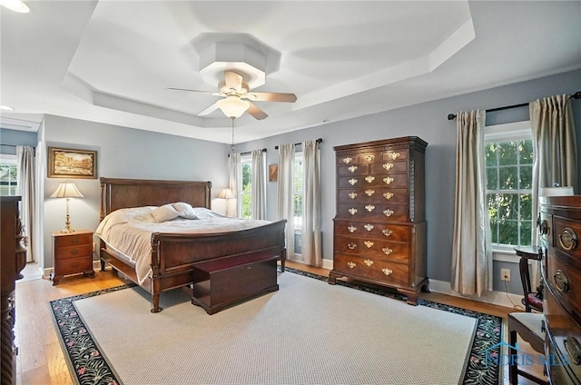 232 E Wayne St, Maumee, OH 43537 - bedroom with a raised ceiling, wood finished floors, and a ceiling fan