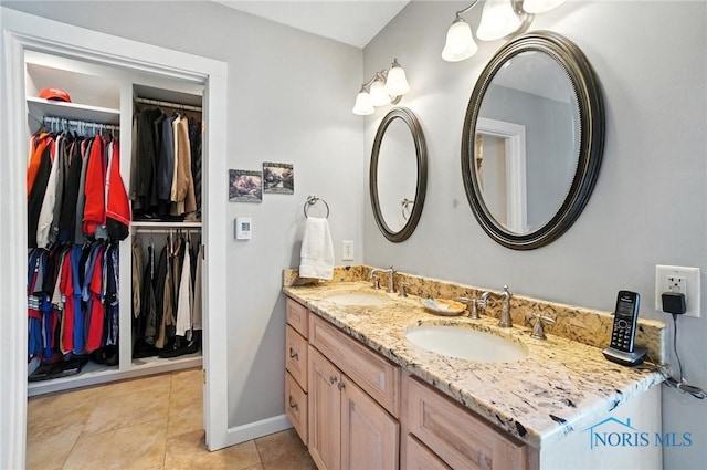 232 E Wayne St, Maumee, OH 43537 - bathroom with double vanity, tile patterned floors, and a walk in closet