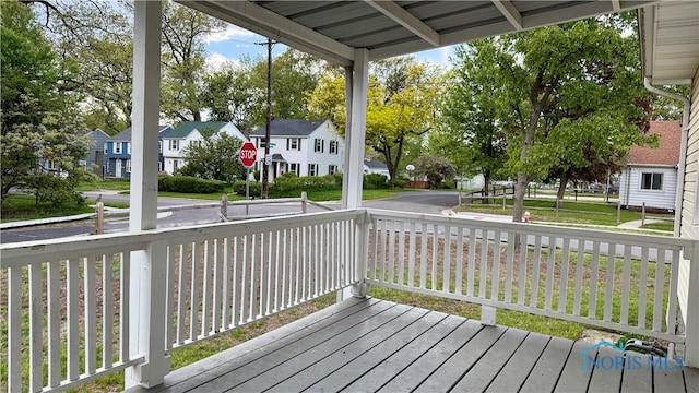 2659 Oak Grove Pl, Toledo, OH 43613 - wooden porch featuring a residential view