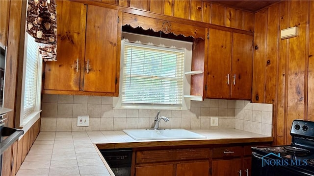 2659 Oak Grove Pl, Toledo, OH 43613 - kitchen featuring black appliances, a sink, backsplash, and healthy amount of natural light