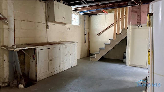 2659 Oak Grove Pl, Toledo, OH 43613 - basement featuring stairs and concrete block wall