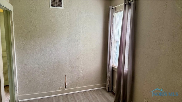 2659 Oak Grove Pl, Toledo, OH 43613 - empty room featuring wood finished floors and baseboards