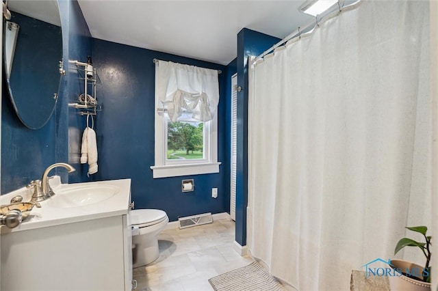3555 Island Ave, Toledo, OH 43614 - full bath featuring toilet, vanity, and baseboards