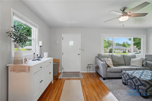 entrance foyer with light wood finished floors and ceiling fan