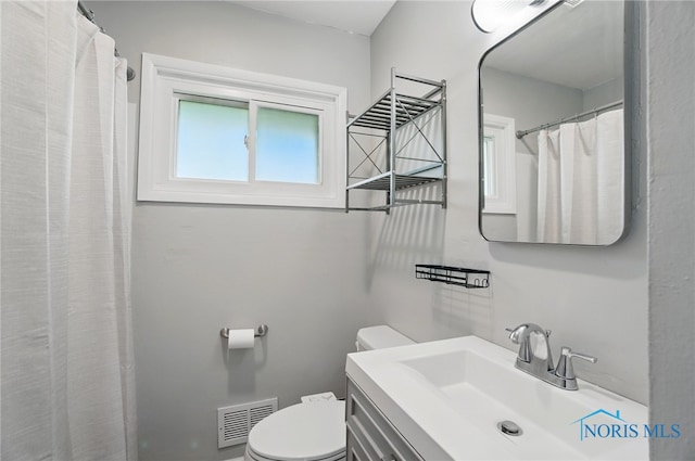 full bath with toilet and vanity