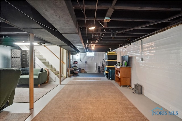 basement featuring stairs