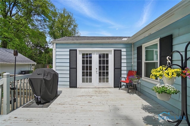 wooden deck featuring grilling area and french doors