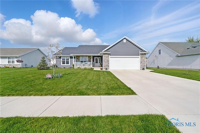 9274 Shaffer St, Findlay, OH 45840 - single story home featuring concrete driveway, an attached garage, a front yard, covered porch, and stone siding