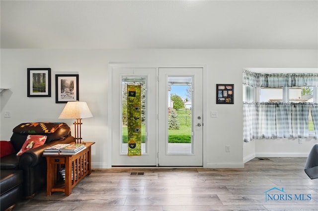 9274 Shaffer St, Findlay, OH 45840 - doorway to outside with wood finished floors and baseboards