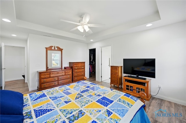 9274 Shaffer St, Findlay, OH 45840 - bedroom with a tray ceiling, wood finished floors, recessed lighting, baseboards, and a closet