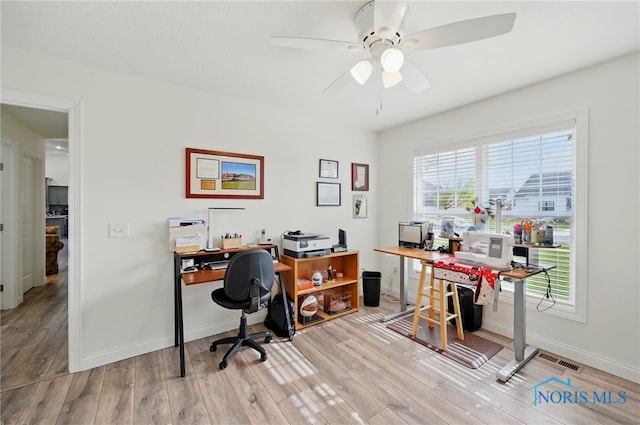 9274 Shaffer St, Findlay, OH 45840 - home office featuring ceiling fan, wood finished floors, and baseboards