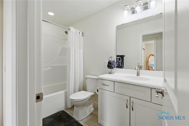 9274 Shaffer St, Findlay, OH 45840 - bathroom featuring tile patterned flooring, toilet, vanity, and shower / bathtub combination with curtain