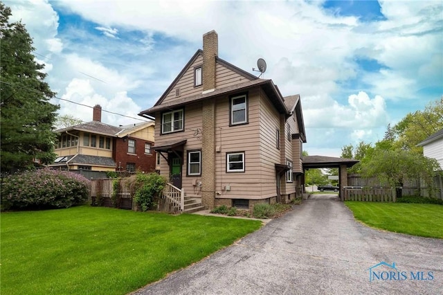 1211 S Main St, Findlay, OH 45840 - back of house featuring a chimney