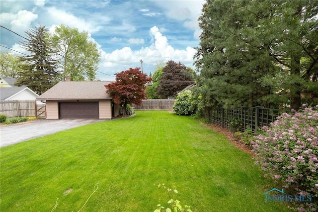 1211 S Main St, Findlay, OH 45840 - view of yard with an outdoor structure and a garage