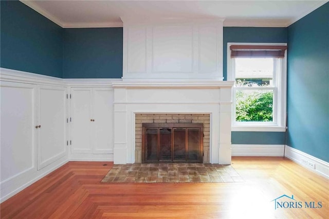 1211 S Main St, Findlay, OH 45840 - unfurnished living room featuring crown molding and a brick fireplace
