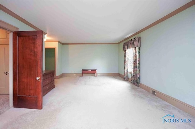 1211 S Main St, Findlay, OH 45840 - unfurnished living room featuring light carpet, ornamental molding, and baseboards
