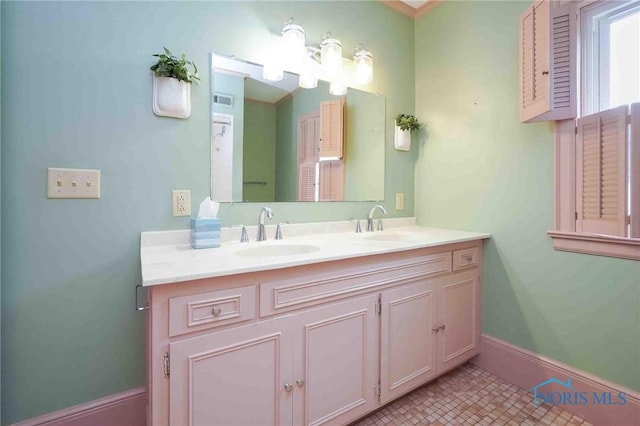 1211 S Main St, Findlay, OH 45840 - bathroom with double vanity and baseboards