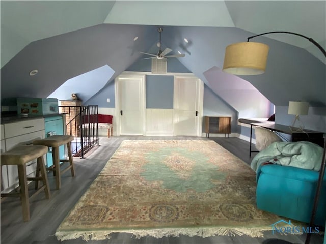 bonus room with vaulted ceiling, ceiling fan, and wood finished floors