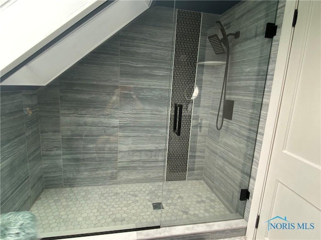 full bath with a shower stall
