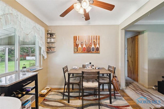 3333 Heatherdowns Blvd, Toledo, OH 43614 - dining space with wood finished floors, ceiling fan, and baseboards