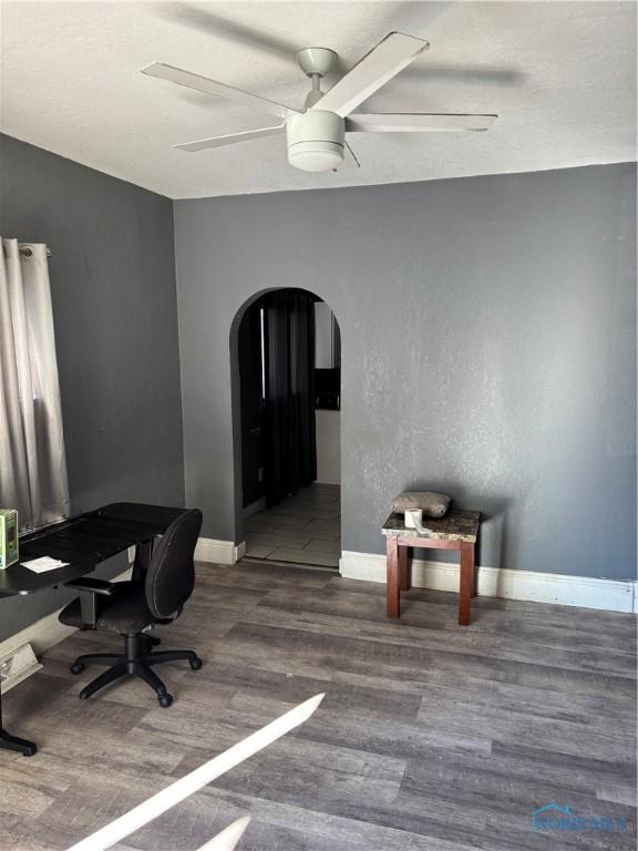315 Austin St, Toledo, OH 43608 - office area with arched walkways, ceiling fan, and wood finished floors
