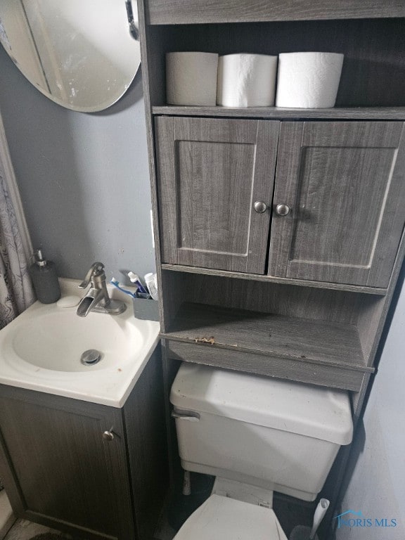128 E Lane Ave, Lima, OH 45801 - bathroom with vanity and toilet