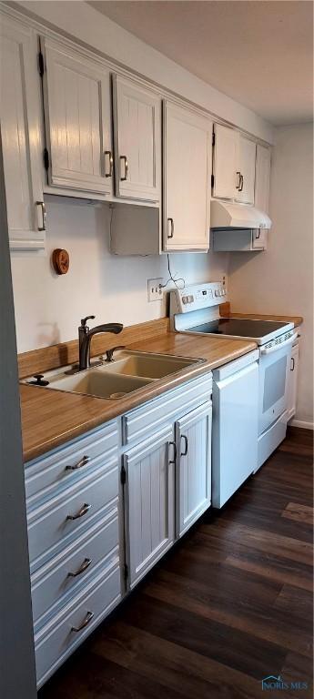 856 Village Pkwy, Waterville, OH 43566 - kitchen featuring white range with electric cooktop, a sink, under cabinet range hood, and dark wood finished floors