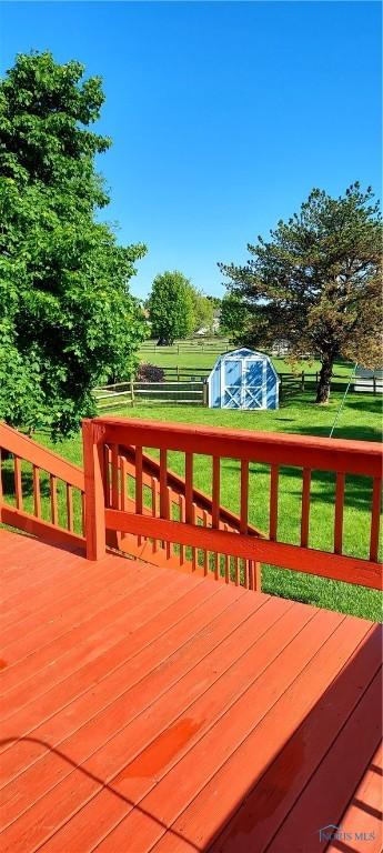 856 Village Pkwy, Waterville, OH 43566 - deck featuring a storage unit and an outdoor structure