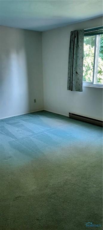 856 Village Pkwy, Waterville, OH 43566 - empty room featuring baseboard heating, carpet floors, and baseboards