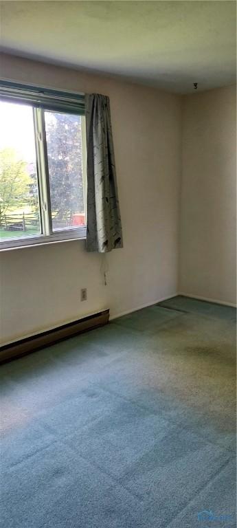 856 Village Pkwy, Waterville, OH 43566 - carpeted spare room featuring baseboard heating