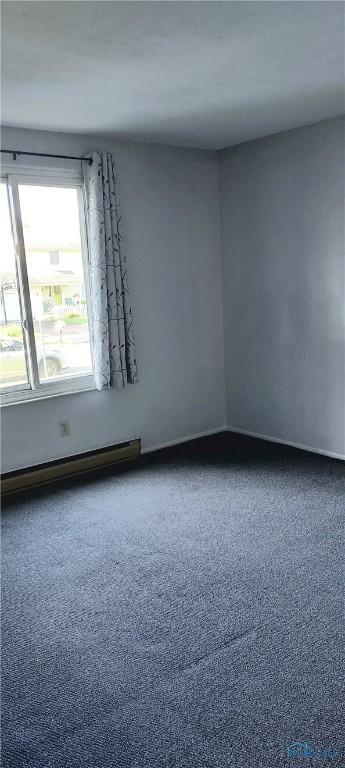 856 Village Pkwy, Waterville, OH 43566 - spare room featuring a baseboard radiator
