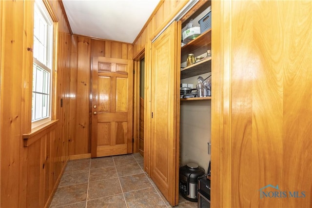 1619 Grant Blvd, Findlay, OH 45840 - corridor featuring wooden walls and dark stone finish floors