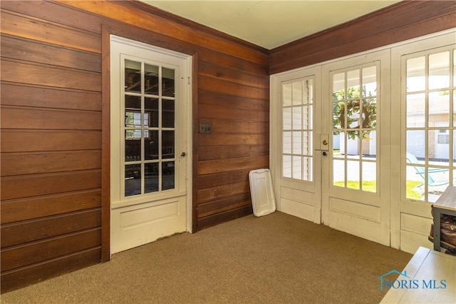 1619 Grant Blvd, Findlay, OH 45840 - doorway to outside featuring carpet flooring, french doors, wooden walls, and healthy amount of natural light