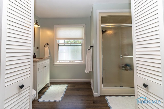 1619 Grant Blvd, Findlay, OH 45840 - bathroom featuring a stall shower, vanity, wood finished floors, and baseboards
