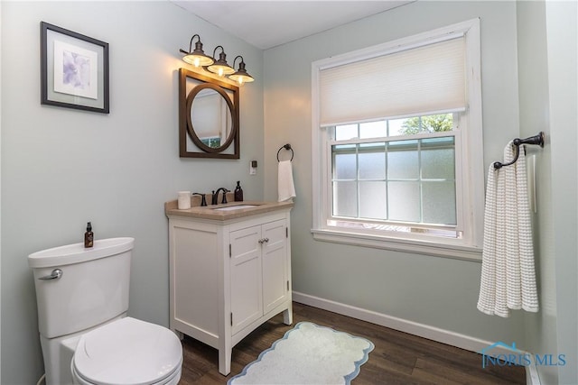 1619 Grant Blvd, Findlay, OH 45840 - half bath featuring wood finished floors, vanity, toilet, and baseboards