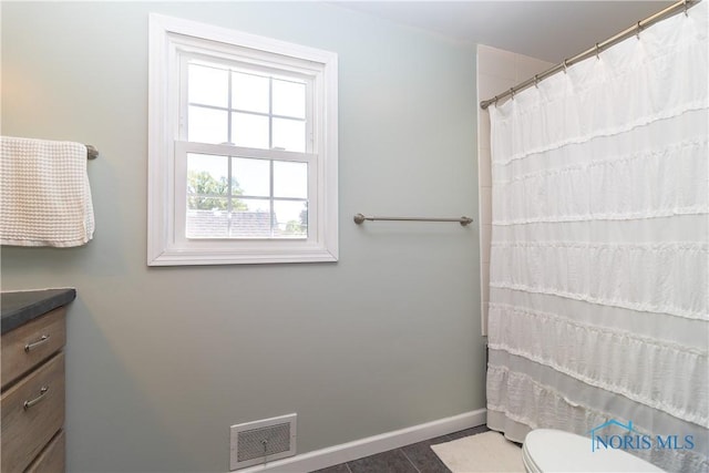 1619 Grant Blvd, Findlay, OH 45840 - bathroom with baseboards, vanity, toilet, and a shower with shower curtain