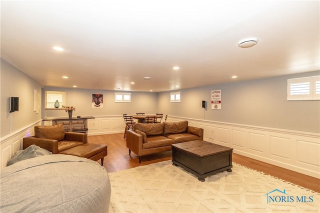 1619 Grant Blvd, Findlay, OH 45840 - living area with light wood finished floors, a decorative wall, recessed lighting, and wainscoting