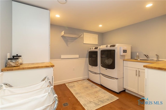 1619 Grant Blvd, Findlay, OH 45840 - washroom featuring independent washer and dryer, cabinet space, dark wood-style floors, and recessed lighting