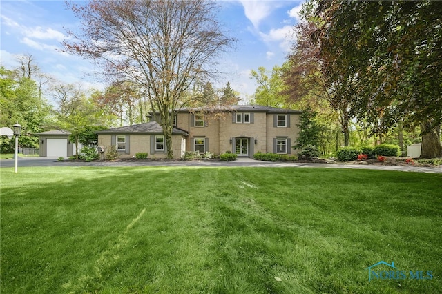 colonial home with a front yard